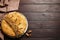 Traditional galette des rois with decorative crown on wooden table, flat lay. Space for text