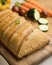 Traditional Galician empanada filled with vegetables and anchovies.