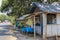 Traditional gas station on Java island in Indonesia. Wooden stand with gasoline in glass liter bottles ready for sale.