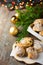 Traditional German Austrian Swiss Christmas pastry mini stollen cakes or cookies in wicker basket and on wood serving board