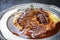 Traditional German braised veal cheeks in brown sauce with mashed potatoes