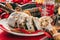 Traditional German Christmas cake - Cranberry Stollen, Christmas tree, ornaments, and candles