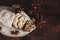 Traditional German Christmas cake - Cranberry Stollen, Christmas tree, ornaments, and candles