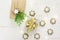 Traditional German star shaped cinnamon cookies with icing golden light garland gift box in craft and silver paper paper juniper