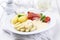 Traditional German white asparagus with serrano ham and boiled potatoes on a classic design plate