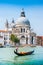 Traditional Gondola on Canal Grande with Basilica di Santa Maria, Venice, Italy