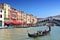Traditional gondolas on Canal Grande at famous Rialto bridge. Venice Italy.