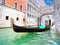 Traditional Gondolas passing over Bridge of Sighs in Venice