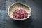 Traditional gourmet red wine salt in a earthenware bowl