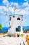 Traditional Greece white windmill at summer day