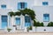 Traditional greek architecture houses painted white with blue doors and window shutters
