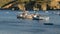 The traditional Greek boats for fishing near beach at sunset