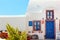 Traditional Greek house with blue door and windows, Santorini