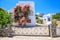 Traditional Greek house with bougainvillea flowers in Thira, Santorini, Greece