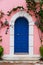 Traditional greek house with colorful blue door and pink walls at Asos village. Assos peninsula famous and extremely