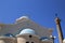 Traditional Greek orthodox church with ancient pillar on Greek Island