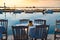 Traditional Greek tavern table near the sea at sunset