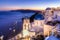 Traditional greek village of Oia at dusk, Santorini island, Greece.