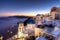 Traditional greek village of Oia at dusk, Santorini island, Greece.