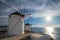 Traditional greek windmills on Mykonos island at sunrise, Cyclades, Greece