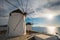 Traditional greek windmills on Mykonos island at sunrise, Cyclades, Greece