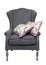 Traditional grey arm chair with floral cushions