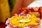 Traditional Haldi turmeric kept on a flower plate for the hindu marriage ceremony