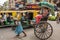 Traditional hand pulled indian rickshaw driver working on the street in Kolkata, West Bengal, India