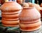 Traditional Handmade clay brown cups, pots and plates in Asian local market,Oriental bazaar. Old pottery. Exhibits ancient times