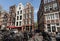 Traditional historic Dutch gable houses beside canal in Amsterdam