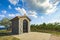 Traditional historic small chapel near a vineyard in Croatia on a summer day