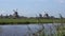 Traditional Holland Windmills in Zaanse Schans, Netherlands. Touristic Village near the Amsterdam with the windmills and