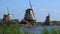 Traditional Holland Windmills in Zaanse Schans, Netherlands. Touristic Village near the Amsterdam with the windmills and