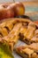 Traditional homemade apple pie with nuts and cinnamon close up a