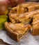 Traditional homemade apple pie with nuts and cinnamon close up a