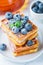 Traditional homemade Belgian Viennese waffles with fresh berries, blueberry souffle and powdered sugar