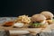 traditional homemade cheeseburgers on baking paper with french fries, ketchup