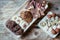 Traditional homemade Christmas cookies: Variety of sweet European cookies on rustic wooden desk, powdered sugar