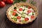 Traditional homemade quiche lorraine tart pie with broccoli and tomatoes