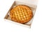 Traditional homemade rustic baked pie with seasonal fruit or meat filling in cardboard box isolated on white. Fast food to go.