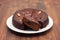 Traditional honey cake of Madeira, Portugal on white plate