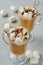 Traditional hot winter drink or healthy Christmas cocktail - spicy latte or cocoa with chocolate powder and marshmallows