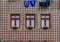 Traditional house facade decorated with ornate Portuguese azulejo tiles and laundry hanging outside in Porto, Portugal