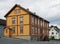 Traditional house in the modern street of Tromso.