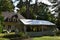 Traditional house with a tent in the garden to prepare a birthday party.