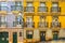 Traditional houses with entrance doors, balconies and windows in Lisbon