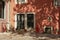 Traditional houses with r ed painted wall and shadow of a tree in Alfama district, Lisbon