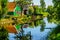 Traditional Houses reflecting in the Canal in the Historic Village of Zaanse Schans