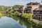 Traditional houses reflecting in a river in Furong Zhen town, Hunan province, Chi