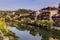 Traditional houses reflecting in a river in Furong Zhen town, Hunan province, Chi